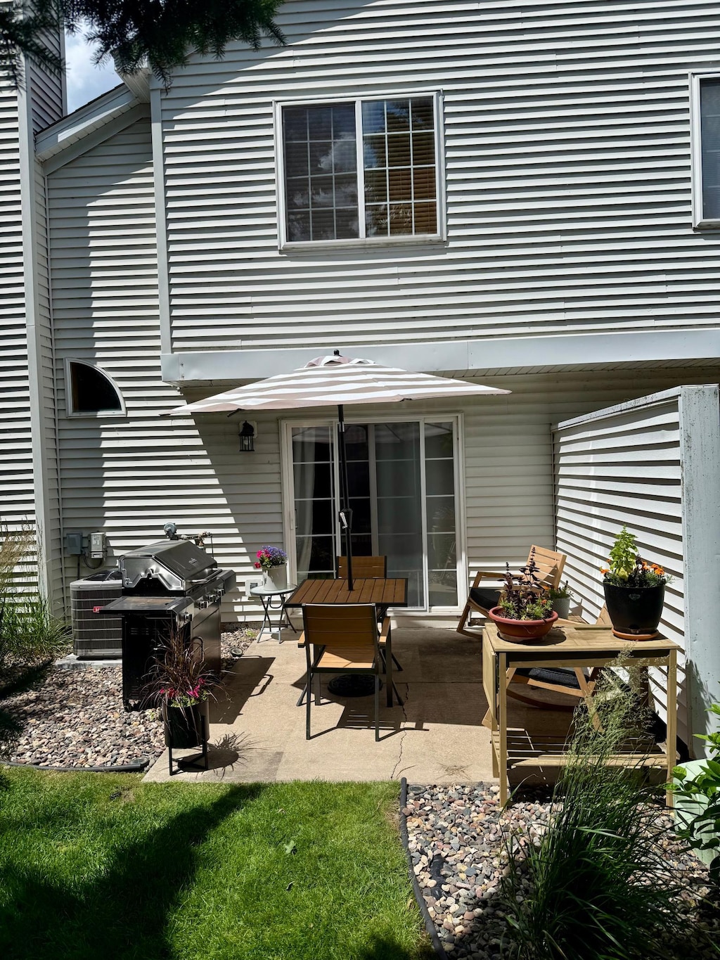 8744 Bechtel Ave Unit 109, Inver Grove Heights, MN 55076 - rear view of house with a patio area
