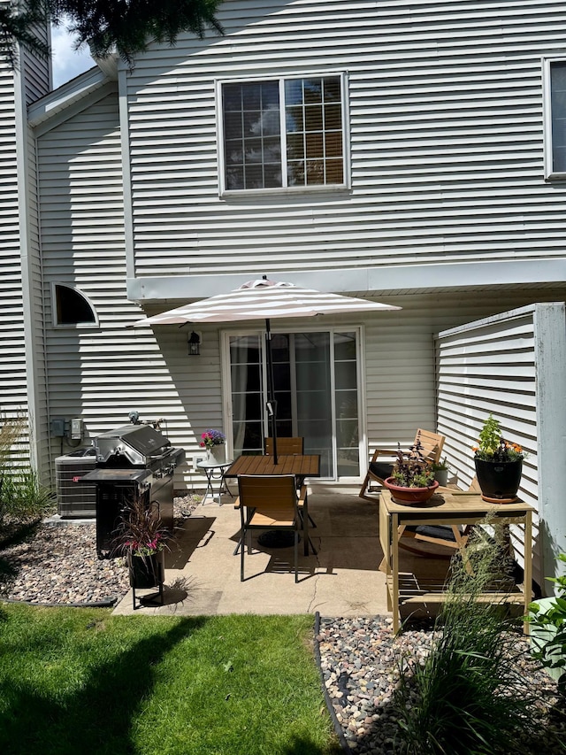 8744 Bechtel Ave Unit 109, Inver Grove Heights, MN 55076 - rear view of house with a patio area