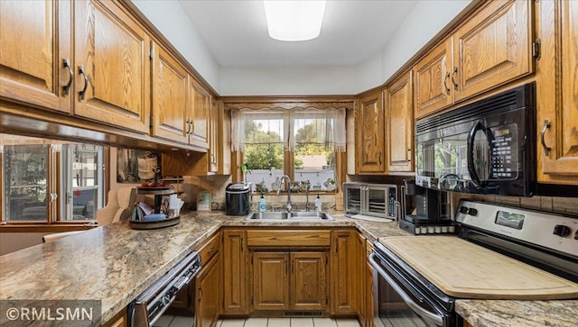 950 Tuva Rd SE, Cokato, MN 55321 - kitchen featuring black appliances and brown cabinetry