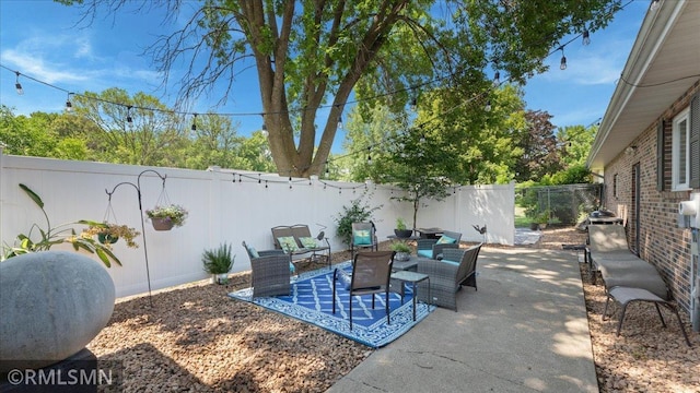 950 Tuva Rd SE, Cokato, MN 55321 - fenced backyard with outdoor lounge area and a patio area