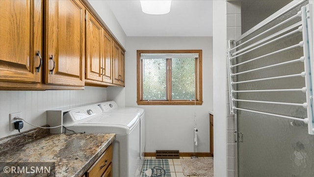 950 Tuva Rd SE, Cokato, MN 55321 - washroom with radiator heating unit, washing machine and dryer, cabinet space, and tile patterned flooring