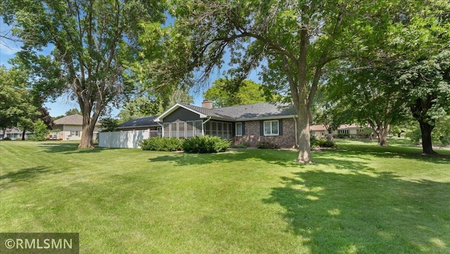 950 Tuva Rd SE, Cokato, MN 55321 - ranch-style house with a sunroom and a chimney