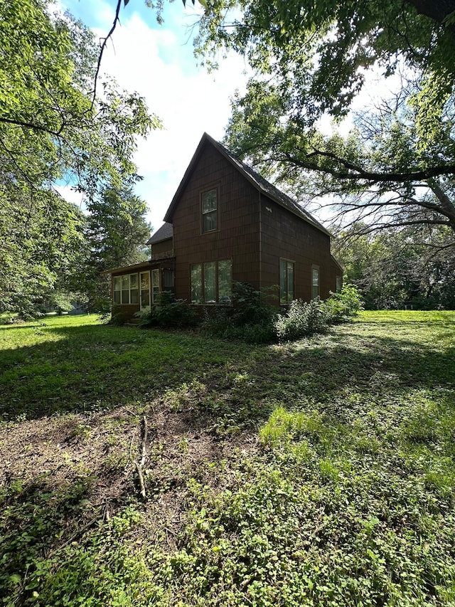 16140 Central Ave NE, Ham Lake, MN 55304 - view of side of home with a yard