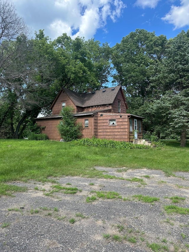 16140 Central Ave NE, Ham Lake, MN 55304 - view of home's exterior with a shingled roof