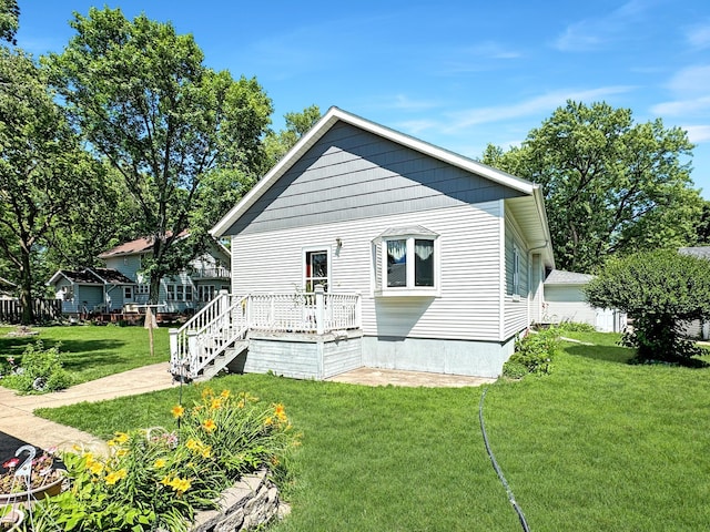 3018 Linden Ave, Slayton, MN 56172 - back of property featuring a yard and a wooden deck