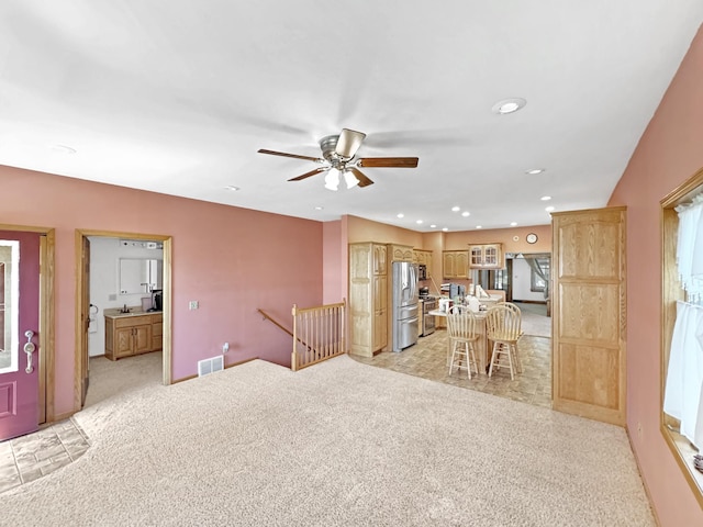 3018 Linden Ave, Slayton, MN 56172 - living area with light carpet, a ceiling fan, and recessed lighting