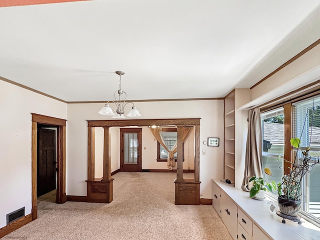 3018 Linden Ave, Slayton, MN 56172 - entrance foyer featuring a chandelier, ornamental molding, and light colored carpet