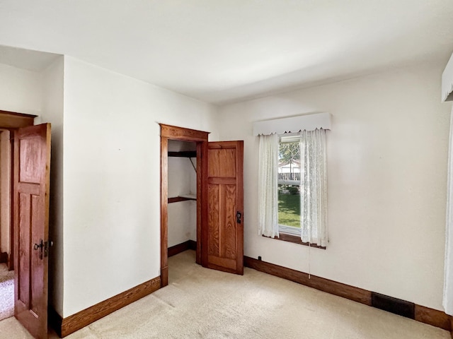 3018 Linden Ave, Slayton, MN 56172 - unfurnished bedroom featuring light colored carpet and baseboards