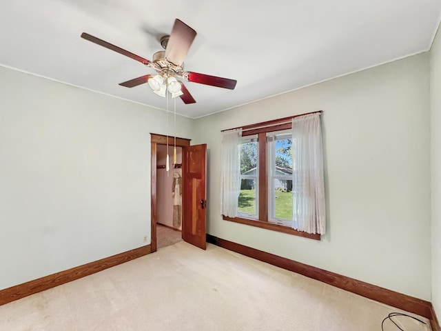 3018 Linden Ave, Slayton, MN 56172 - spare room featuring light carpet and a ceiling fan