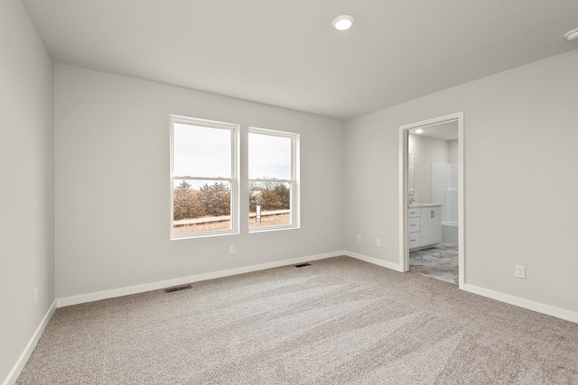 39752 Fallbrook Ave, North Branch, MN 55056 - unfurnished bedroom featuring carpet floors, ensuite bath, and recessed lighting
