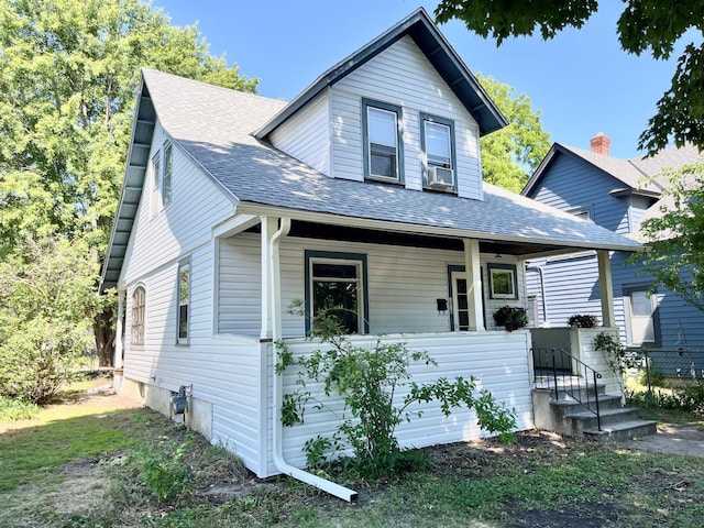 3916 37th Ave S, Minneapolis, MN 55406 - view of front of house with covered porch, roof with shingles, and cooling unit