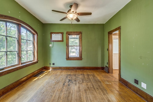 3916 37th Ave S, Minneapolis, MN 55406 - empty room with hardwood / wood-style flooring, healthy amount of natural light, and a ceiling fan