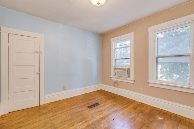 3916 37th Ave S, Minneapolis, MN 55406 - spare room featuring light wood-style flooring and cooling unit