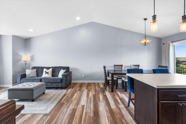 8638 Preserve Blvd N, Chisago City, MN 55013 - living area featuring vaulted ceiling, dark wood-type flooring, a chandelier, and recessed lighting