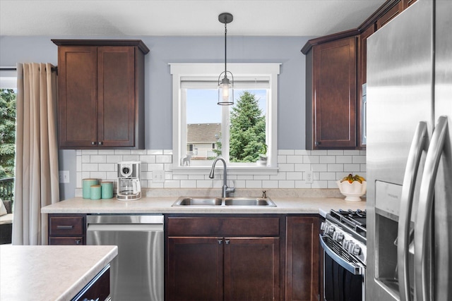 8638 Preserve Blvd N, Chisago City, MN 55013 - kitchen with stainless steel appliances, healthy amount of natural light, light countertops, and tasteful backsplash