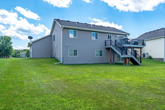 8638 Preserve Blvd N, Chisago City, MN 55013 - rear view of property featuring stairs, a wooden deck, and a lawn