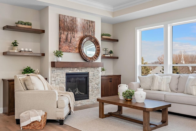 3886 Larabee Ave NE, Saint Michael, MN 55376 - living area featuring ornamental molding, wood finished floors, and a stone fireplace