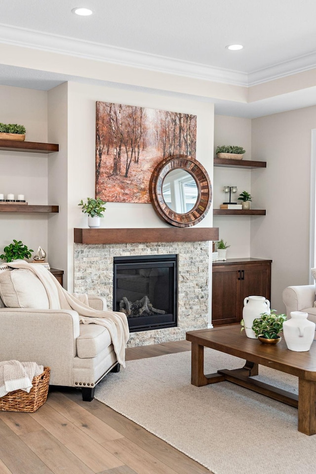 3886 Larabee Ave NE, Saint Michael, MN 55376 - living area with ornamental molding, a glass covered fireplace, wood finished floors, and recessed lighting