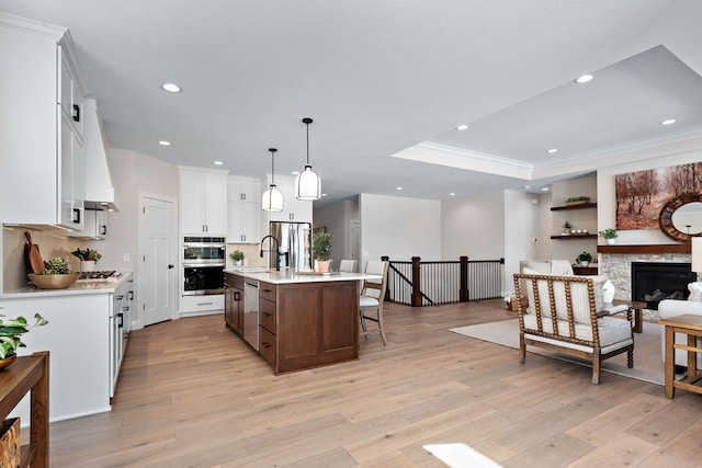 3886 Larabee Ave NE, Saint Michael, MN 55376 - kitchen featuring appliances with stainless steel finishes, light countertops, light wood-type flooring, recessed lighting, and ornamental molding