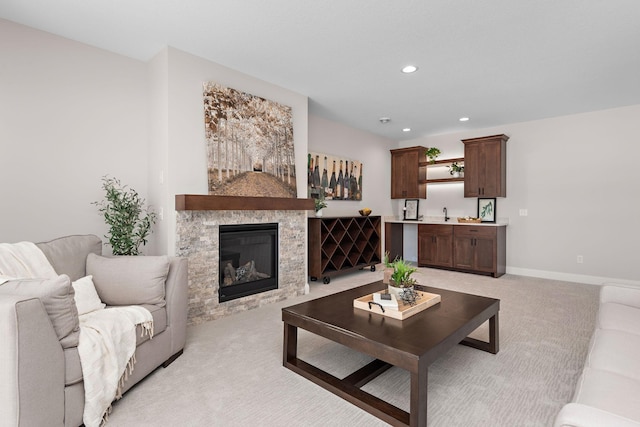 3886 Larabee Ave NE, Saint Michael, MN 55376 - living area featuring light carpet, recessed lighting, and a stone fireplace