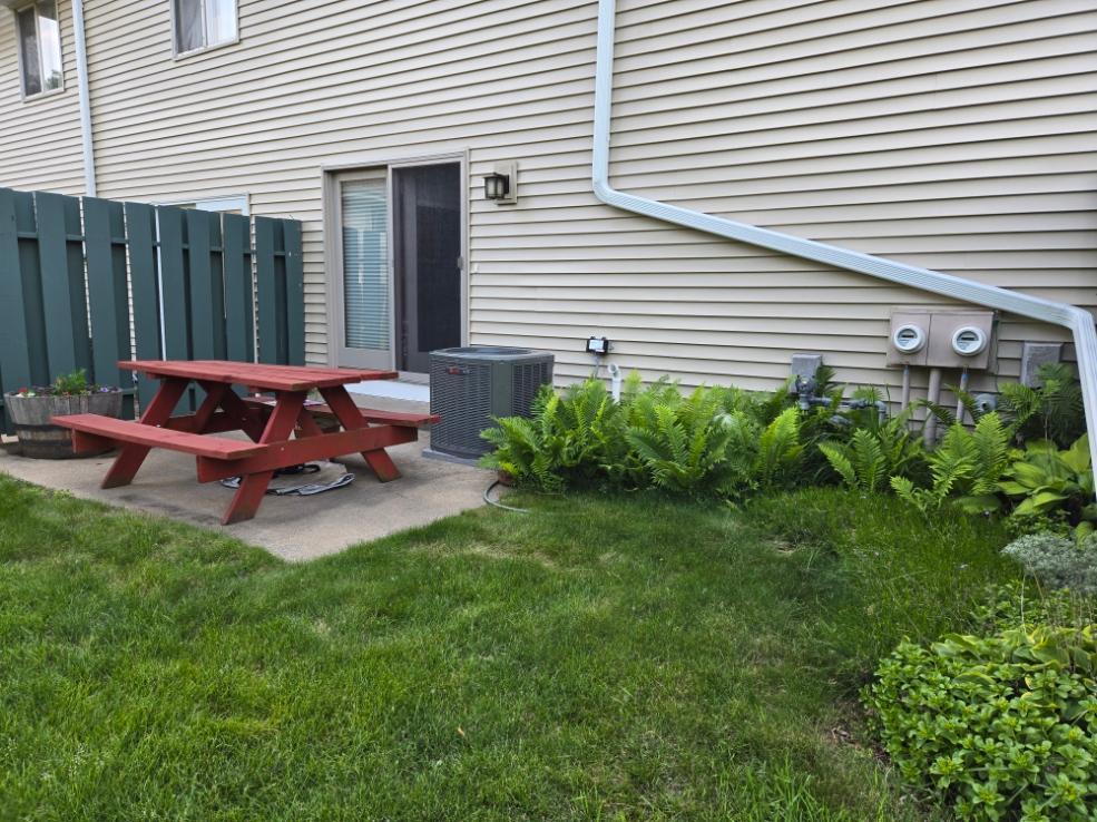 368 Dorland Rd S, Maplewood, MN 55119 - view of green lawn featuring a patio area