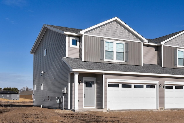 39749 Fallbrook Ave, North Branch, MN 55056 - view of front facade featuring a garage and dirt driveway