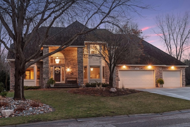 3600 Wedgewood Ln N, Plymouth, MN 55441 - traditional-style house with brick siding, driveway, an attached garage, and a yard