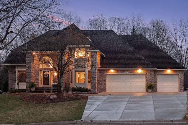 3600 Wedgewood Ln N, Plymouth, MN 55441 - view of front of property with a garage, concrete driveway, a front yard, and brick siding