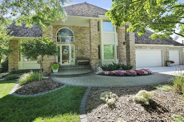 3600 Wedgewood Ln N, Plymouth, MN 55441 - view of front of property featuring an attached garage, brick siding, and concrete driveway