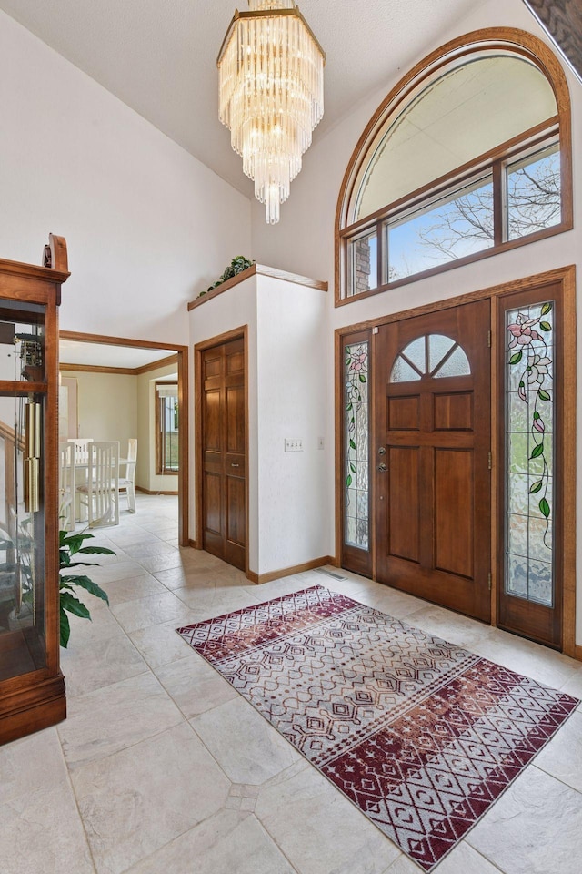 3600 Wedgewood Ln N, Plymouth, MN 55441 - tiled entryway with a chandelier and a towering ceiling