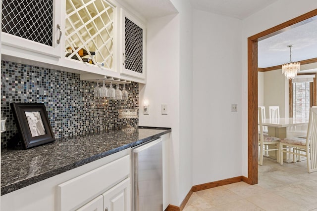 3600 Wedgewood Ln N, Plymouth, MN 55441 - indoor dry bar with backsplash, a chandelier, light tile patterned floors, and decorative light fixtures