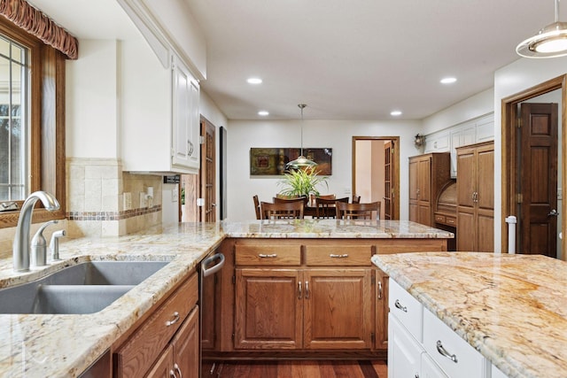 3600 Wedgewood Ln N, Plymouth, MN 55441 - kitchen with a peninsula, dark wood-type flooring, white cabinets, light stone countertops, and recessed lighting