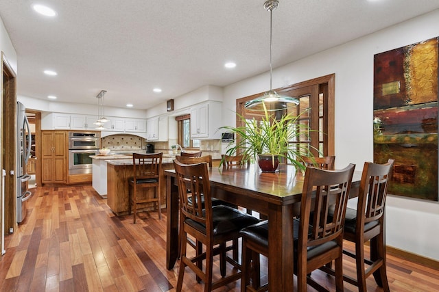 3600 Wedgewood Ln N, Plymouth, MN 55441 - dining area featuring light wood-style floors and recessed lighting
