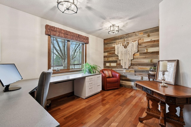 3600 Wedgewood Ln N, Plymouth, MN 55441 - office featuring wooden walls, wood finished floors, a textured ceiling, and built in study area