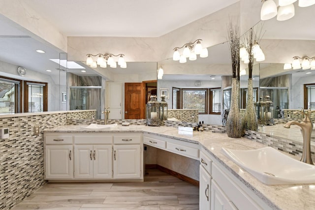 3600 Wedgewood Ln N, Plymouth, MN 55441 - full bath with decorative backsplash, a stall shower, vanity, and wood finished floors