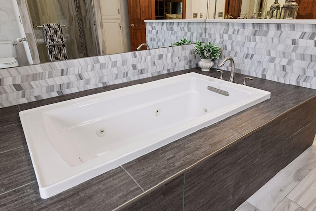 3600 Wedgewood Ln N, Plymouth, MN 55441 - full bathroom with a tub with jets and toilet