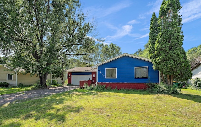 7609 James Ave N, Brooklyn Park, MN 55444 - view of front facade with a front yard and driveway