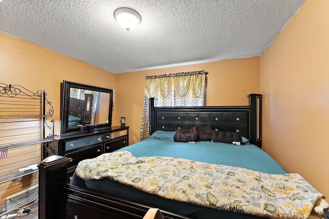 7609 James Ave N, Brooklyn Park, MN 55444 - bedroom with a textured ceiling