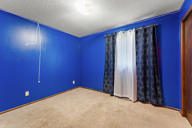7609 James Ave N, Brooklyn Park, MN 55444 - spare room with carpet flooring and a textured ceiling