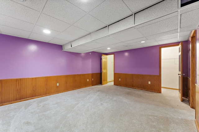 7609 James Ave N, Brooklyn Park, MN 55444 - empty room with wainscoting, a drop ceiling, carpet, wood walls, and recessed lighting