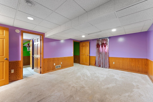 7609 James Ave N, Brooklyn Park, MN 55444 - carpeted empty room featuring a wainscoted wall, wood walls, a drop ceiling, and recessed lighting