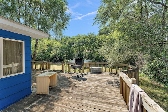 7609 James Ave N, Brooklyn Park, MN 55444 - wooden terrace with view of wooded area