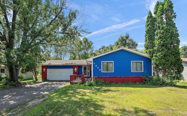 7609 James Ave N, Brooklyn Park, MN 55444 - view of front of home with driveway, an attached garage, a front lawn, and brick siding