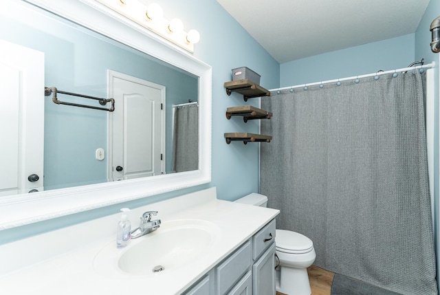 2 Lillie Ln SE, Pine Island, MN 55963 - full bath featuring vanity, wood finished floors, and curtained shower