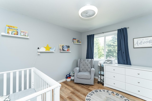 2 Lillie Ln SE, Pine Island, MN 55963 - bedroom with a nursery area and wood finished floors