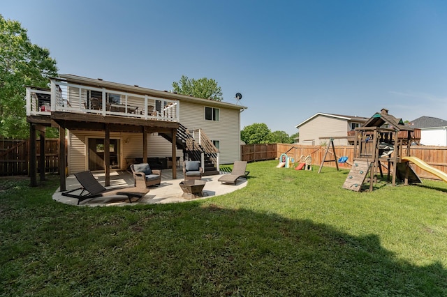 2 Lillie Ln SE, Pine Island, MN 55963 - back of house with a playground, a fenced backyard, a patio, stairs, and a deck