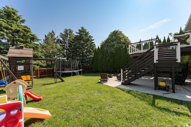 2 Lillie Ln SE, Pine Island, MN 55963 - fenced backyard featuring a trampoline, a playground, a patio area, and stairway