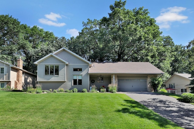 6 Pleasant View Ln, Circle Pines, MN 55014 - view of front of home featuring driveway, a garage, and a front lawn