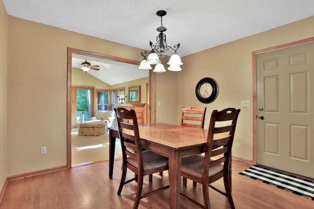 6 Pleasant View Ln, Circle Pines, MN 55014 - dining room with light wood-style floors, a chandelier, and lofted ceiling