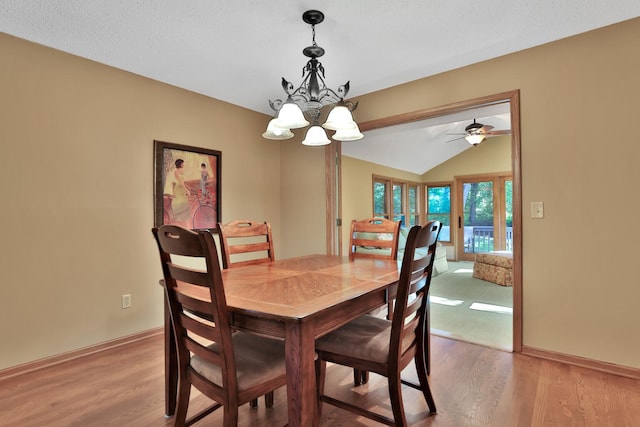 6 Pleasant View Ln, Circle Pines, MN 55014 - dining area featuring light wood-style flooring, a chandelier, and vaulted ceiling